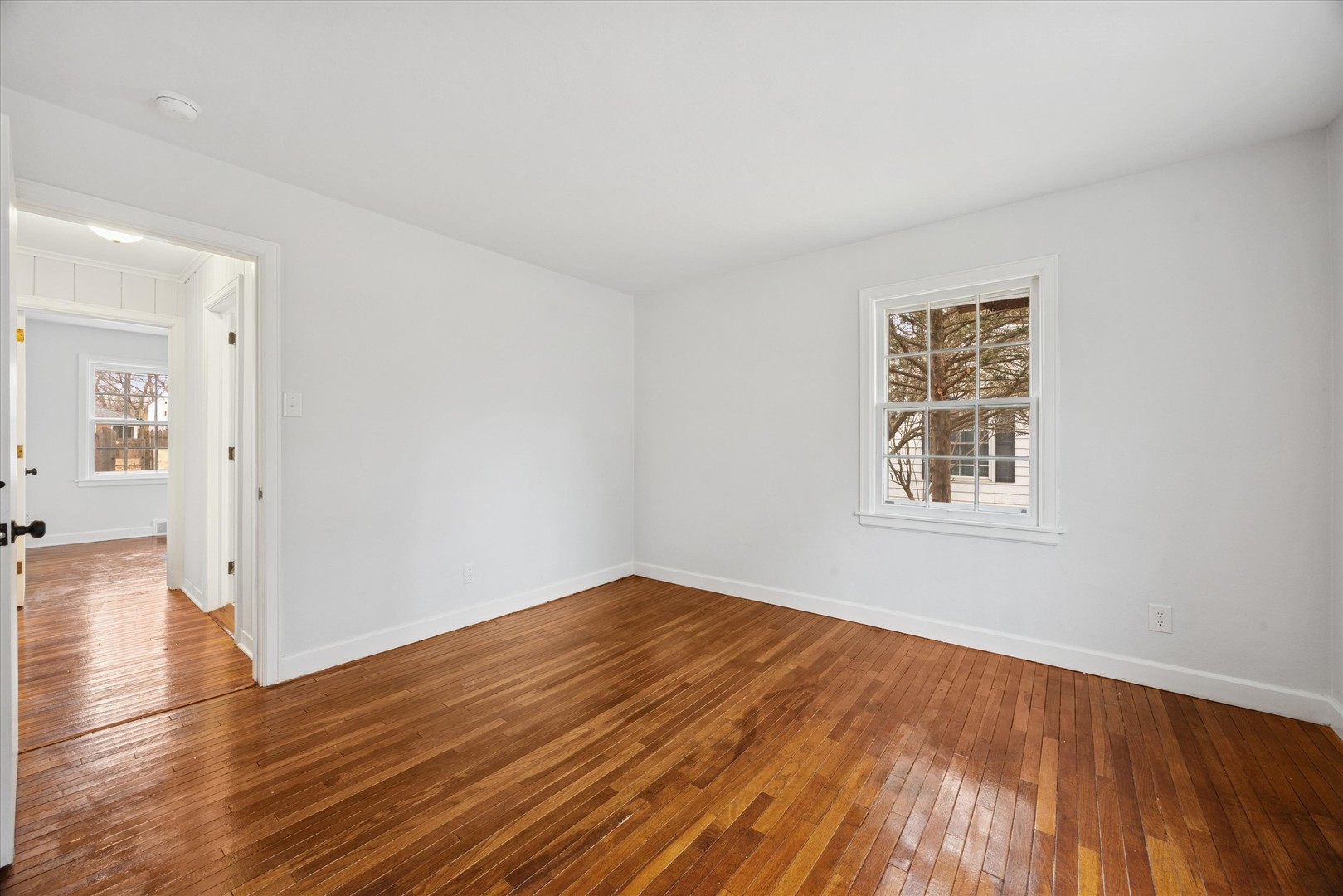 575 South Wall Street Kankakee, IL 60901 - Photo 12 of 28 wooden floor in an empty room with a window