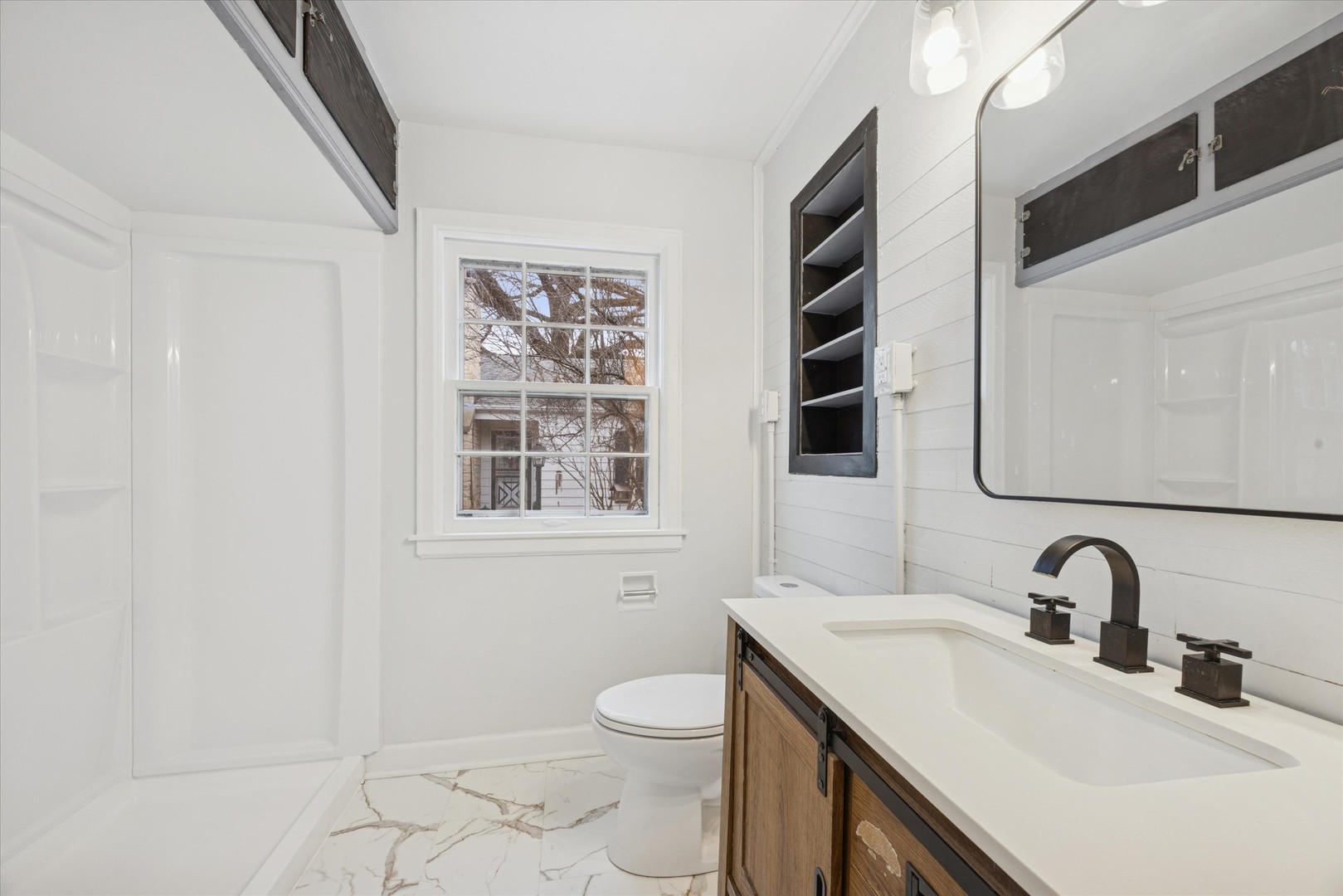 575 South Wall Street Kankakee, IL 60901 - Photo 13 of 28 a bathroom with a toilet a sink and mirror