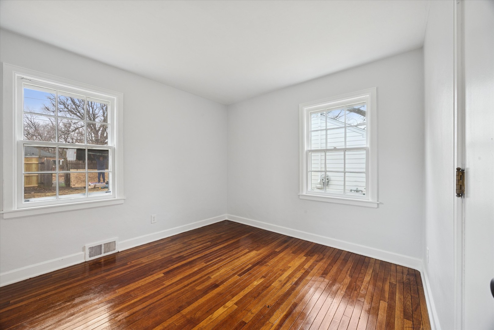 575 South Wall Street Kankakee, IL 60901 - Photo 14 of 28 an empty room with wooden floor and windows