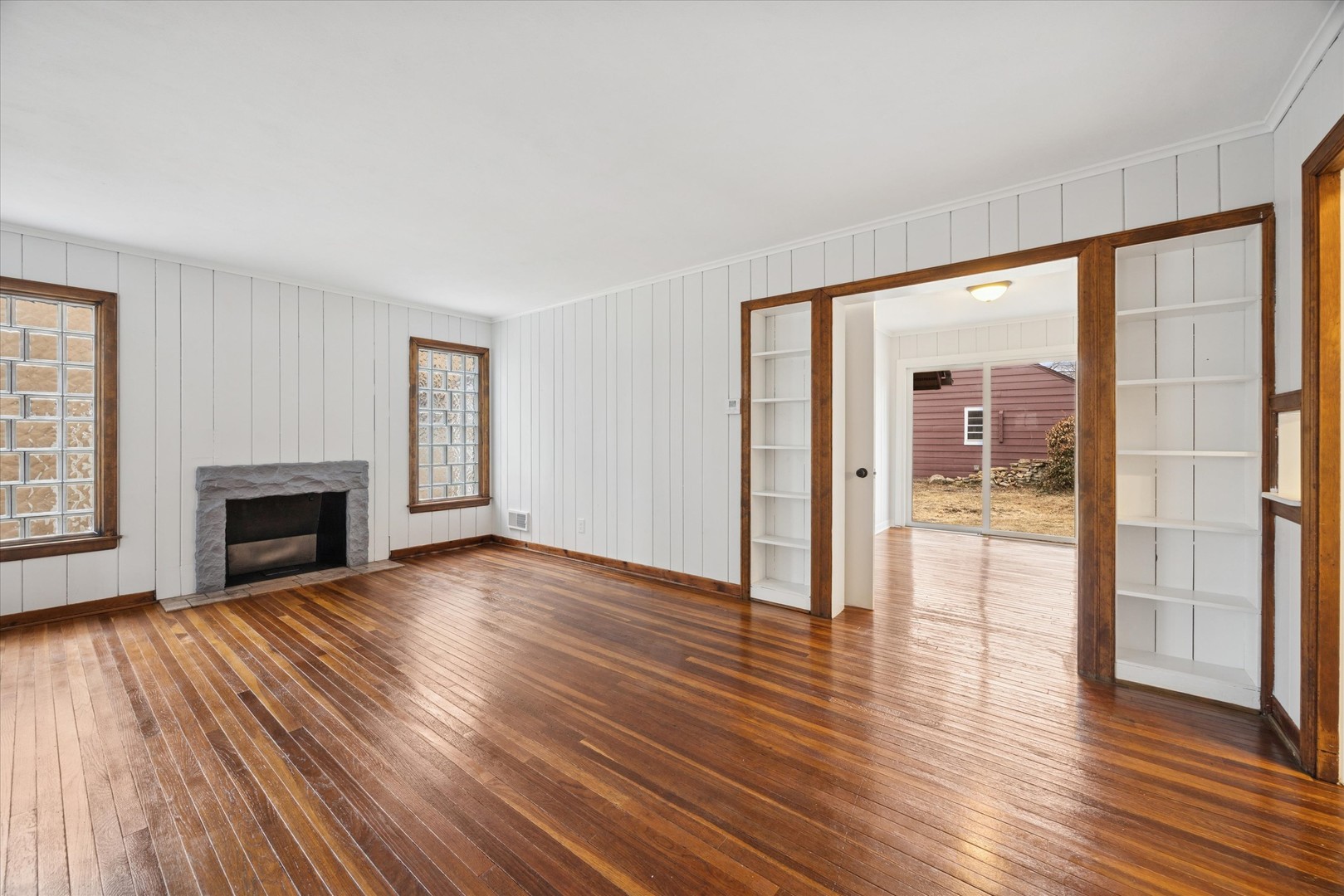 575 South Wall Street Kankakee, IL 60901 - Photo 5 of 28 a view of a livingroom with wooden floor and a fireplace