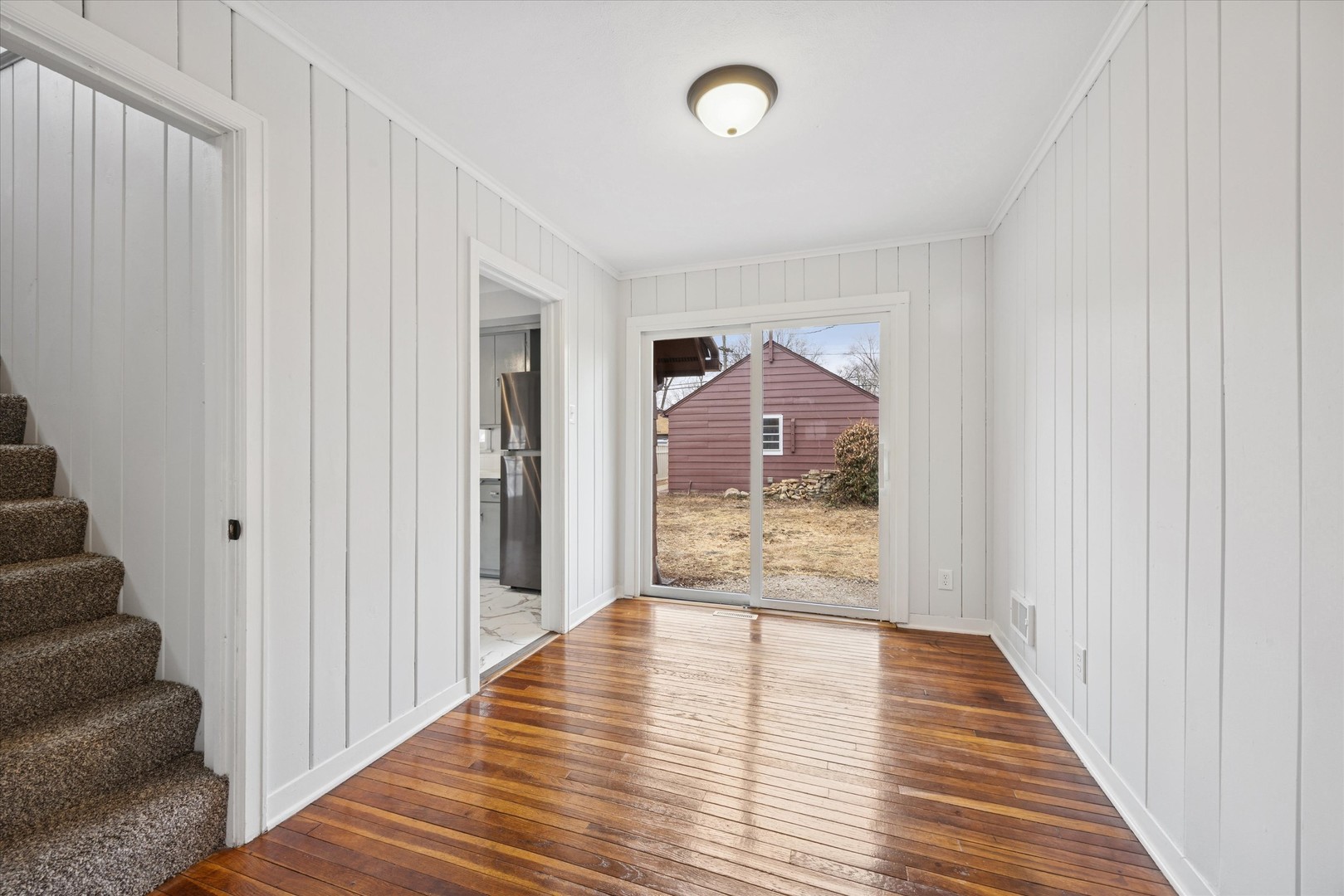 575 South Wall Street Kankakee, IL 60901 - Photo 8 of 28 a view of a hallway view with wooden floor and staircase