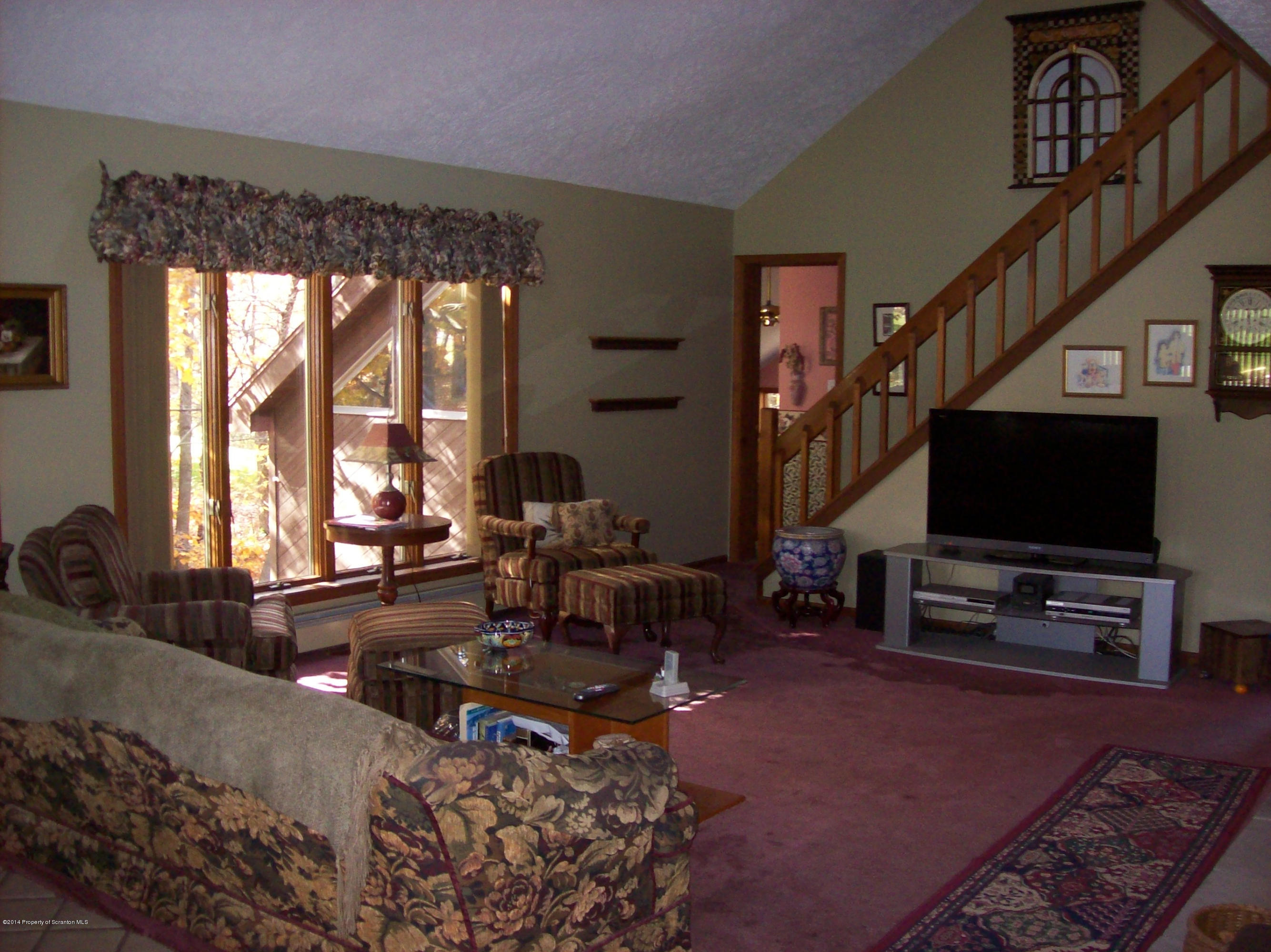 940 Forest Road Lake Ariel, PA 18436 - Photo 3 of 12 a living room with furniture and a flat screen tv
