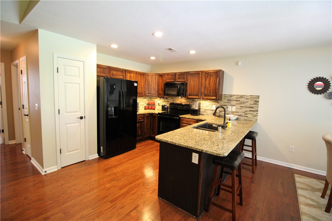 129 Duraleigh Road Anderson, SC 29621 - Photo 2 of 21 Kitchen w/Granite, Back Splash, and Hardwood