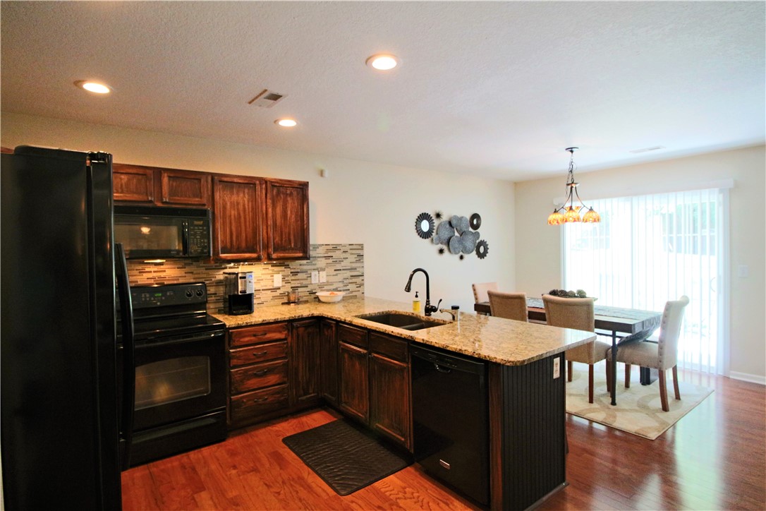 129 Duraleigh Road Anderson, SC 29621 - Photo 6 of 21 Kitchen w/breakfast bar and dining area