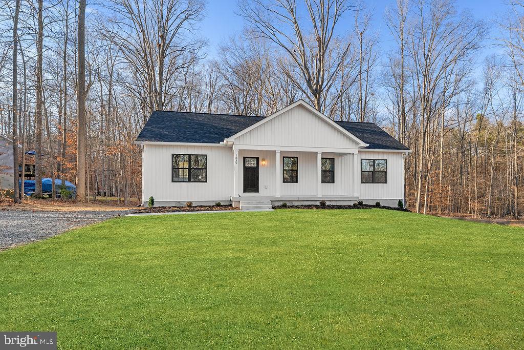 1339 Moody Town Road Bumpass, VA 23024 - Photo 52 of 63 a front view of a house with a garden