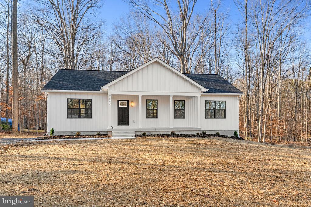1339 Moody Town Road Bumpass, VA 23024 - Photo 55 of 63 a front view of a house with a yard