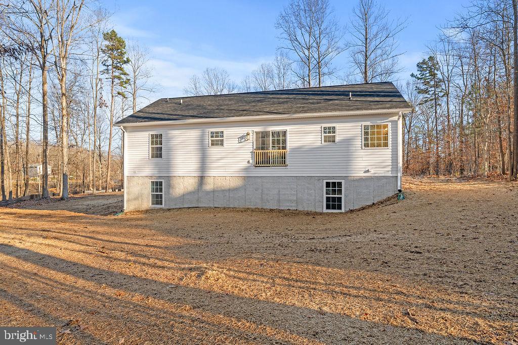 1339 Moody Town Road Bumpass, VA 23024 - Photo 60 of 63 a view of a house with a yard