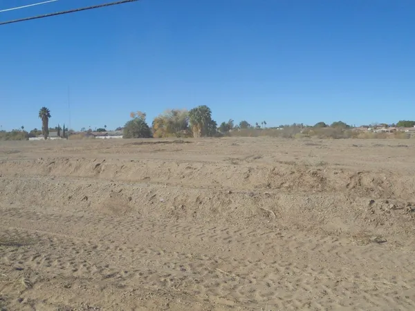a view of ocean with a mountain in the background