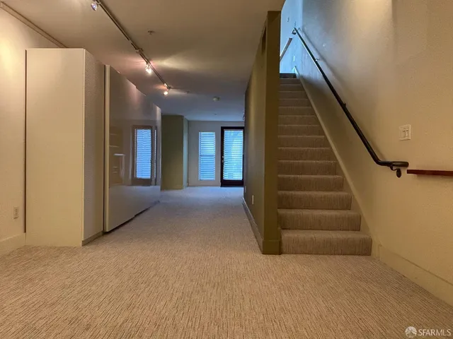 a close view of a utility room with dryer and washer