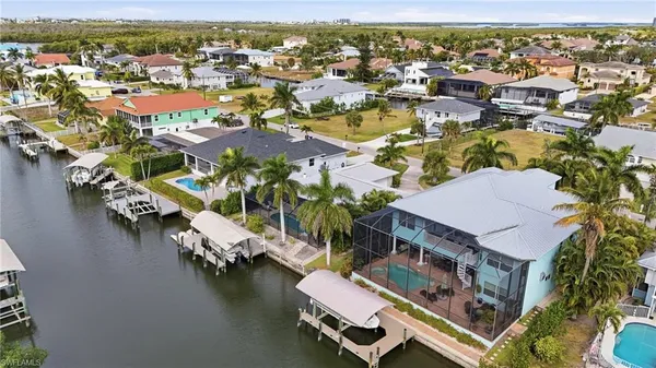 an aerial view of residential houses with outdoor space