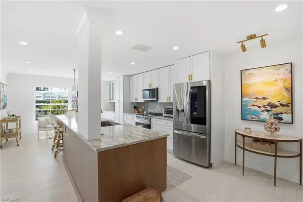 a kitchen with counter top space cabinets and stainless steel appliances