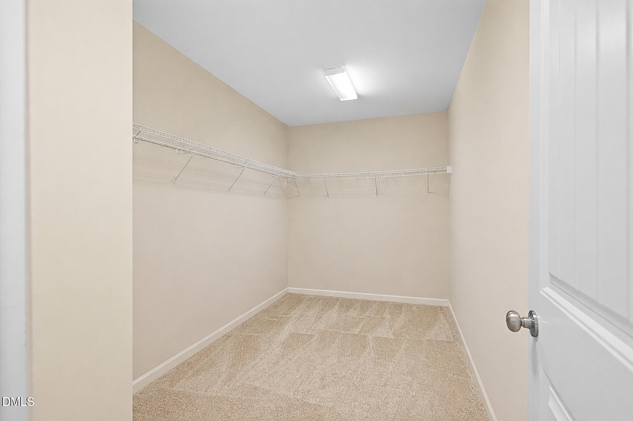 4249 Saubranch Hill Street Raleigh, NC 27616 - Photo 21 of 31 a view of a room with racks on the wall