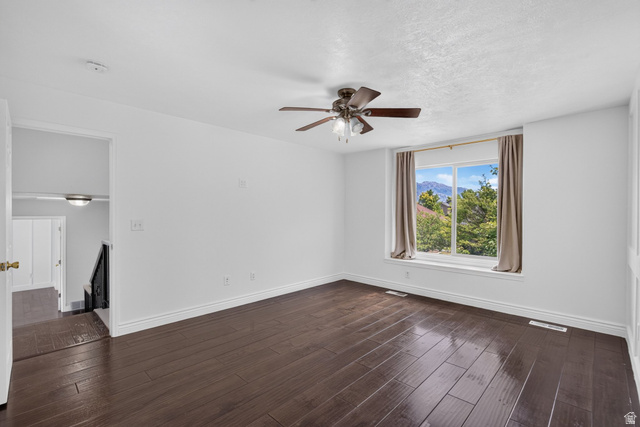 2223 North Pointe Meadow Loop Lehi, UT 84048 - Photo 32 of 56 Spacious room with dark wood-finish flooring, a large window, and a ceiling fan