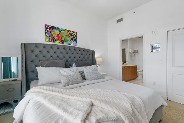 a bedroom with a bed and a couch