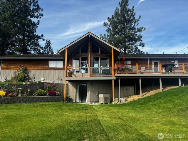 a view of house with outdoor space and garden