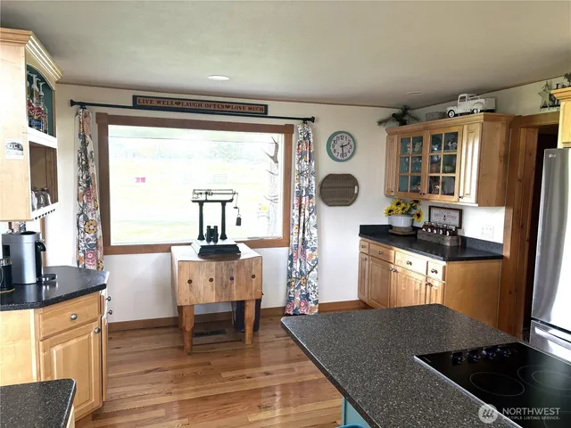 a kitchen with a table chairs and a stove
