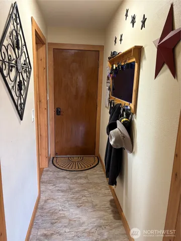 a bathroom with a sink mirror and toilet