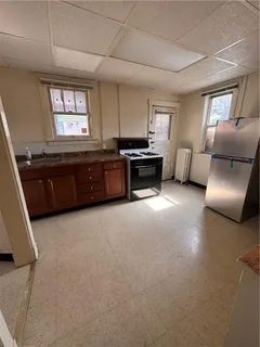 a kitchen with furniture and a fireplace