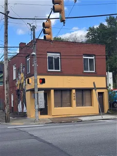 a view of a building with a street