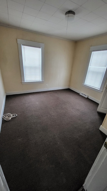 238 Hildreth Street, Unit 238 Lowell, MA 01850 - Photo 13 of 16 an empty room with a window