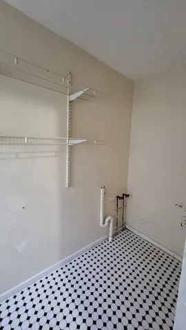 a bedroom with a bed and a table