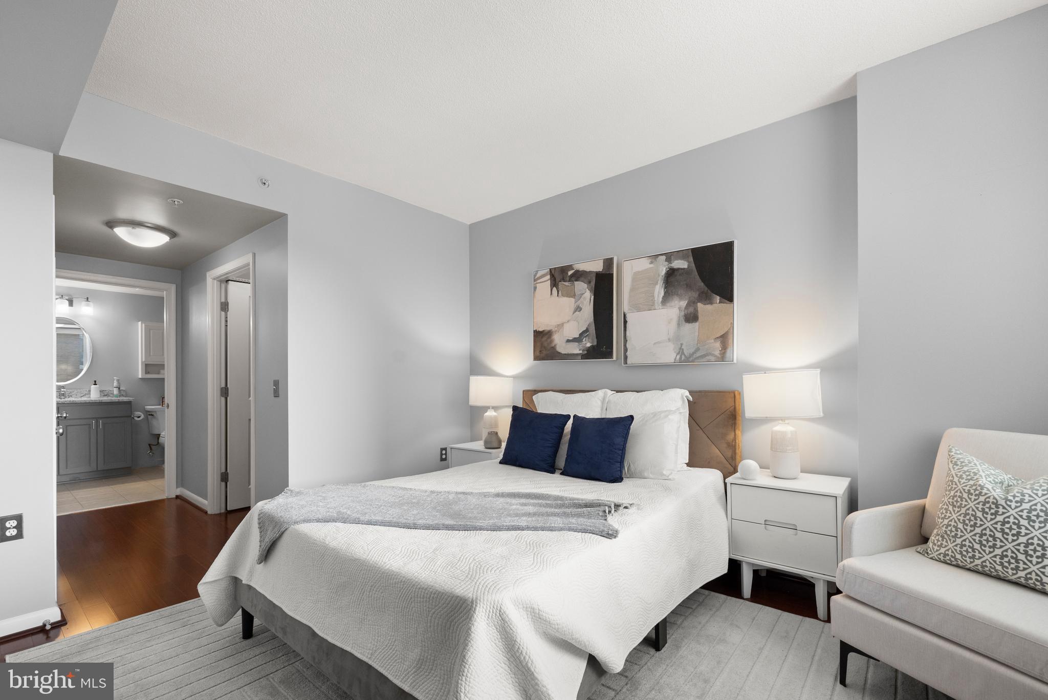 851 North Glebe Road, Unit 1508 Arlington, VA 22203 - Photo 20 of 41 a bedroom with a bed and wooden floor