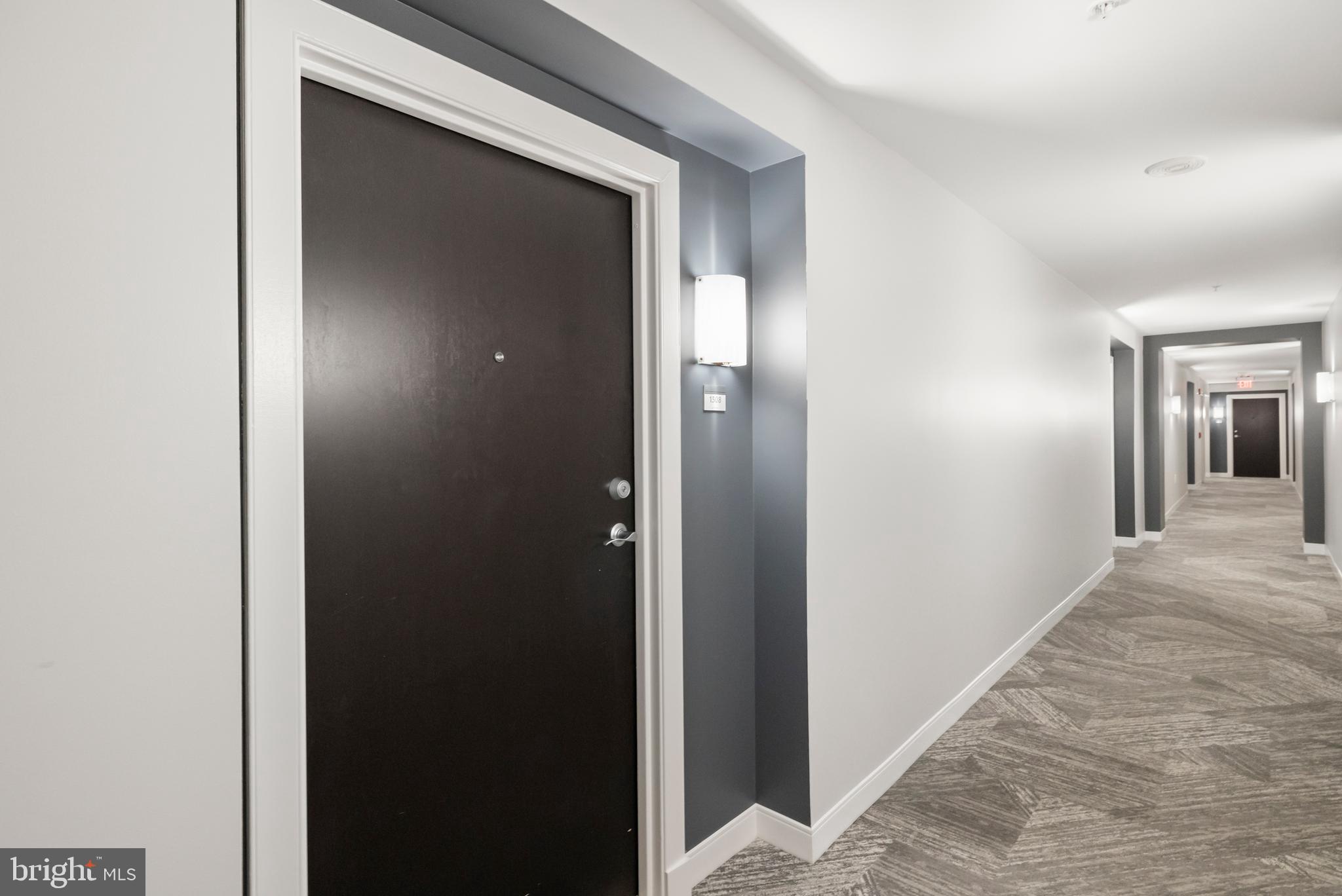851 North Glebe Road, Unit 1508 Arlington, VA 22203 - Photo 2 of 41 a view of a hallway with wooden floor