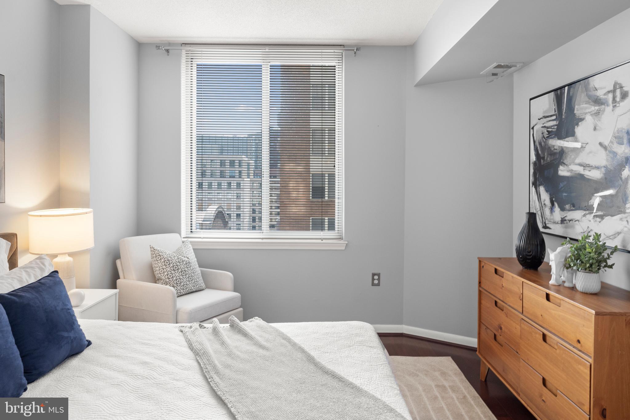 851 North Glebe Road, Unit 1508 Arlington, VA 22203 - Photo 21 of 41 a bedroom with a bed and a window with couch