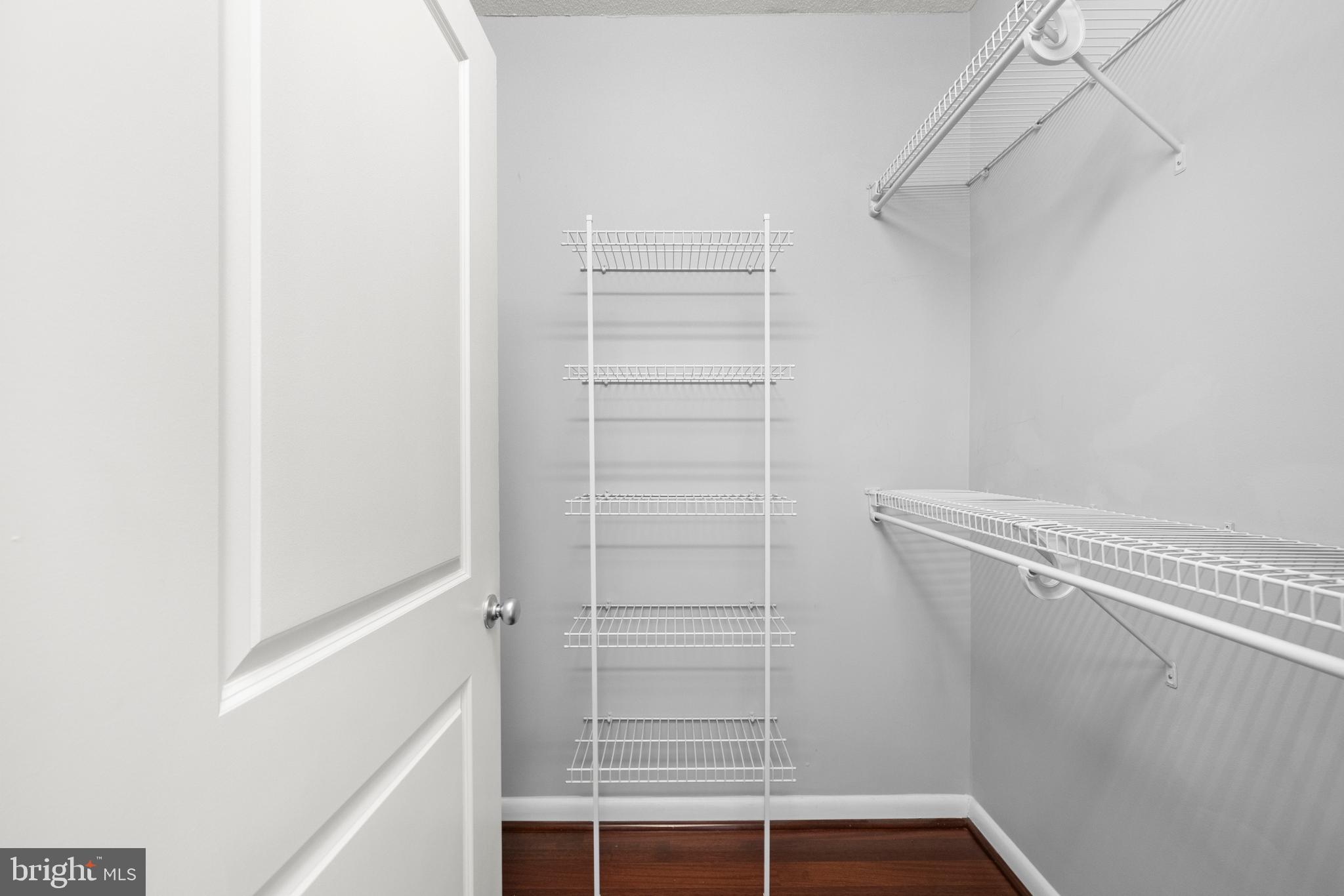851 North Glebe Road, Unit 1508 Arlington, VA 22203 - Photo 22 of 41 a view of walk in closet with empty racks