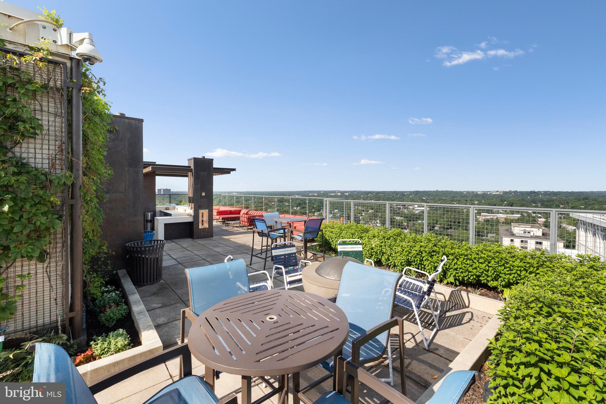 851 North Glebe Road, Unit 1508 Arlington, VA 22203 - Photo 29 of 41 a view of a patio with couches table and chairs and potted plants