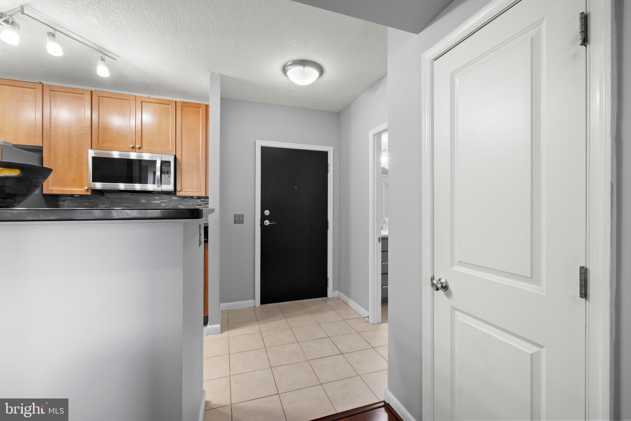 851 North Glebe Road, Unit 1508 Arlington, VA 22203 - Photo 3 of 41 a view of a kitchen with a sink and a refrigerator