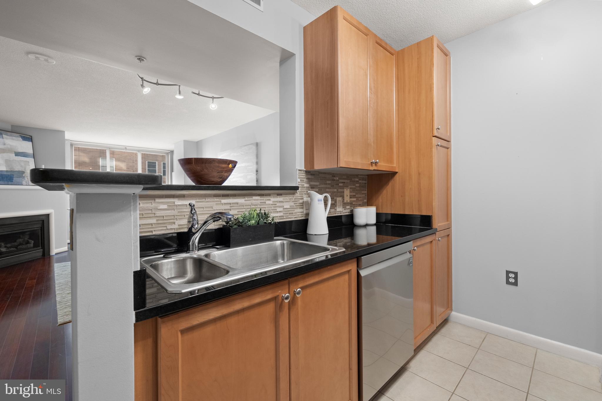 851 North Glebe Road, Unit 1508 Arlington, VA 22203 - Photo 9 of 41 a kitchen with stainless steel appliances granite countertop a sink a stove and a refrigerator