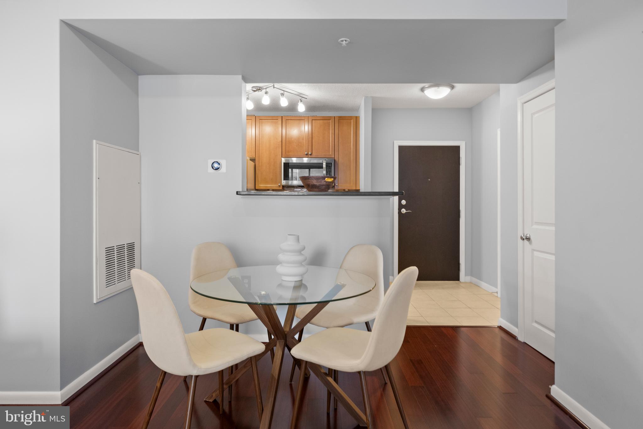851 North Glebe Road, Unit 1508 Arlington, VA 22203 - Photo 10 of 41 a view of a dining room with furniture and wooden floor