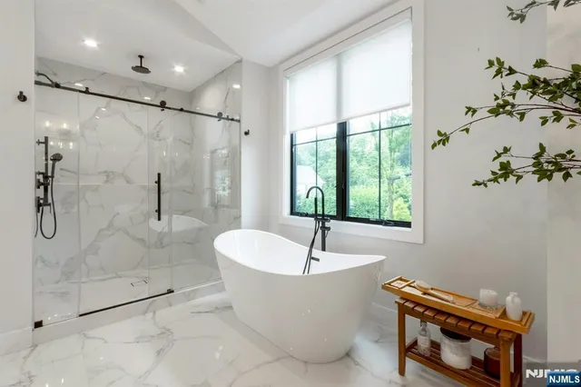 a bathroom with a bathtub and shower