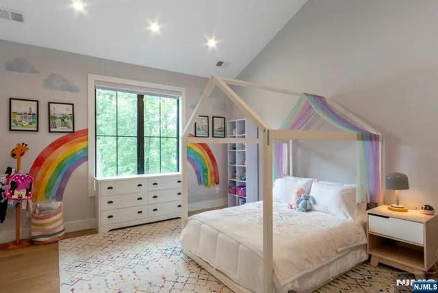 a bedroom with bed and a window