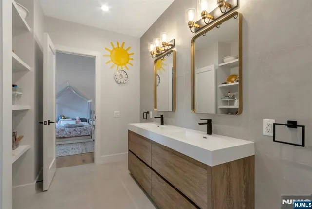 a bathroom with a sink a vanity and a mirror
