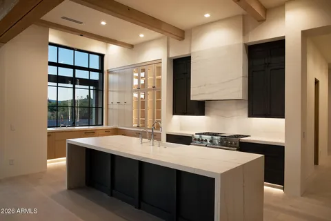 a bathroom with a sink double vanity and a mirror