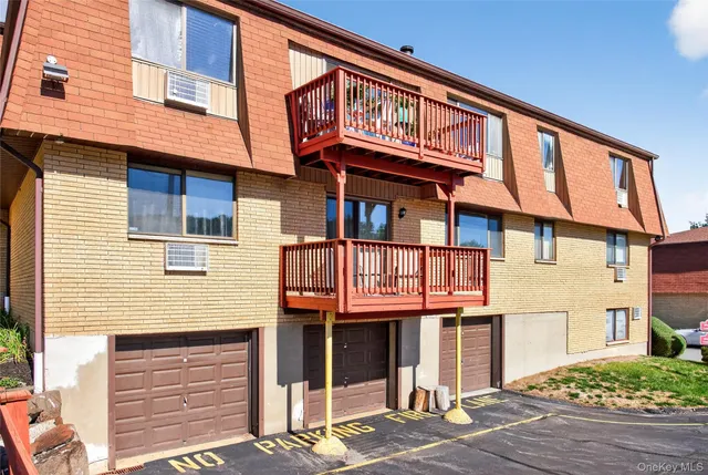 a view of a balcony with chairs and a table