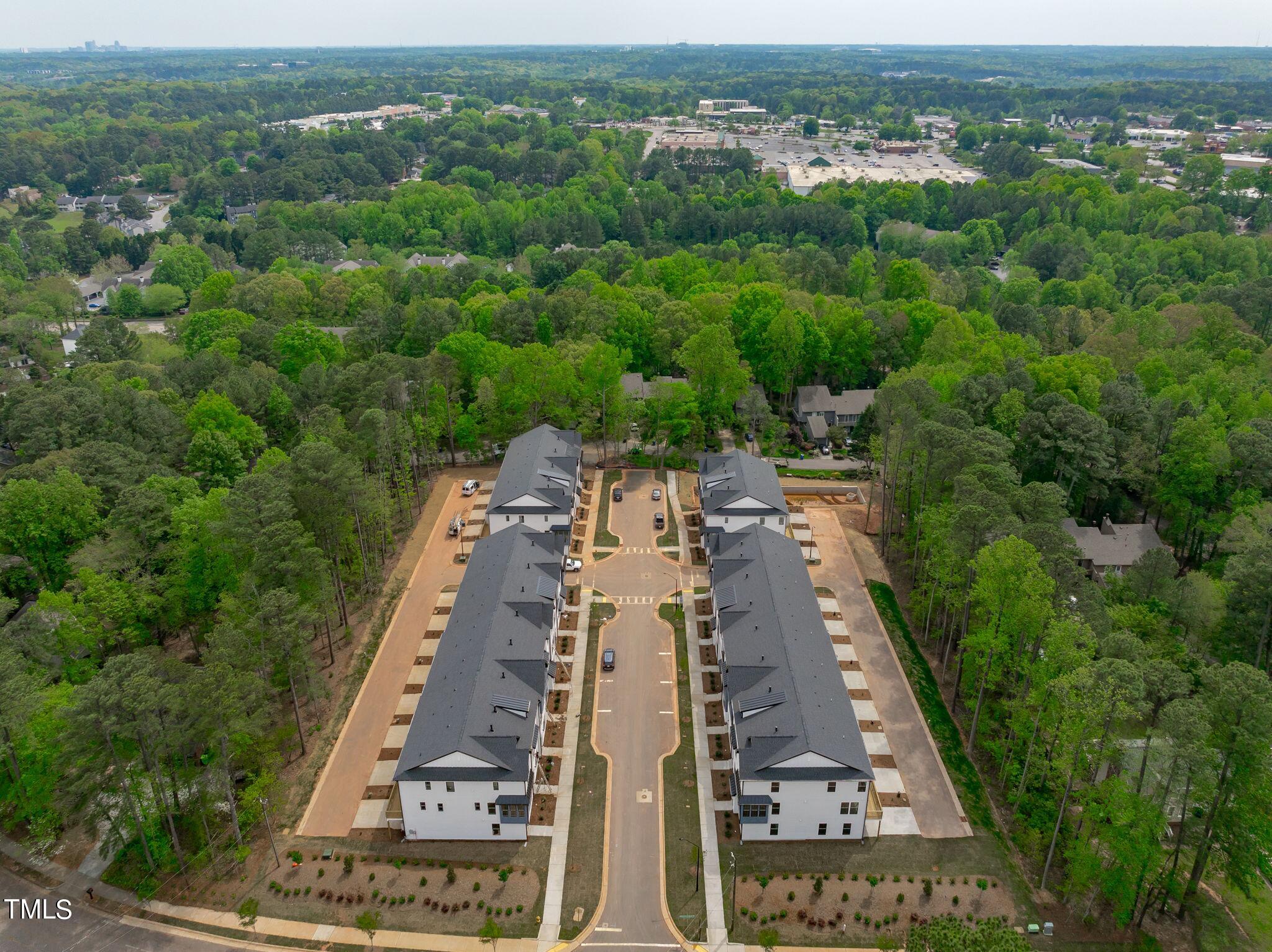 6402 Tanner Oak Lane Raleigh, NC 27613 - Photo 36 of 50 an aerial view of a city with lots of residential buildings