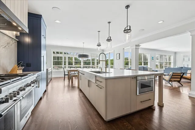 a kitchen with stainless steel appliances a stove top oven and sink