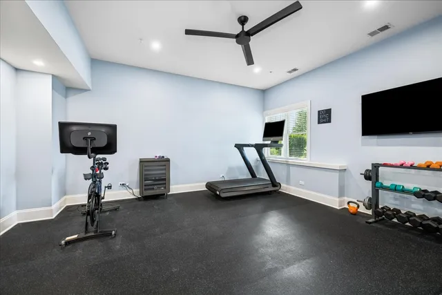 a view of a livingroom with furniture and a flat screen tv