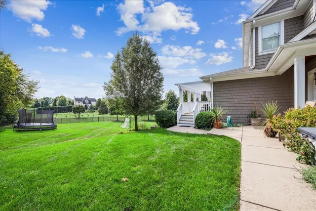 a view of a house with a back yard