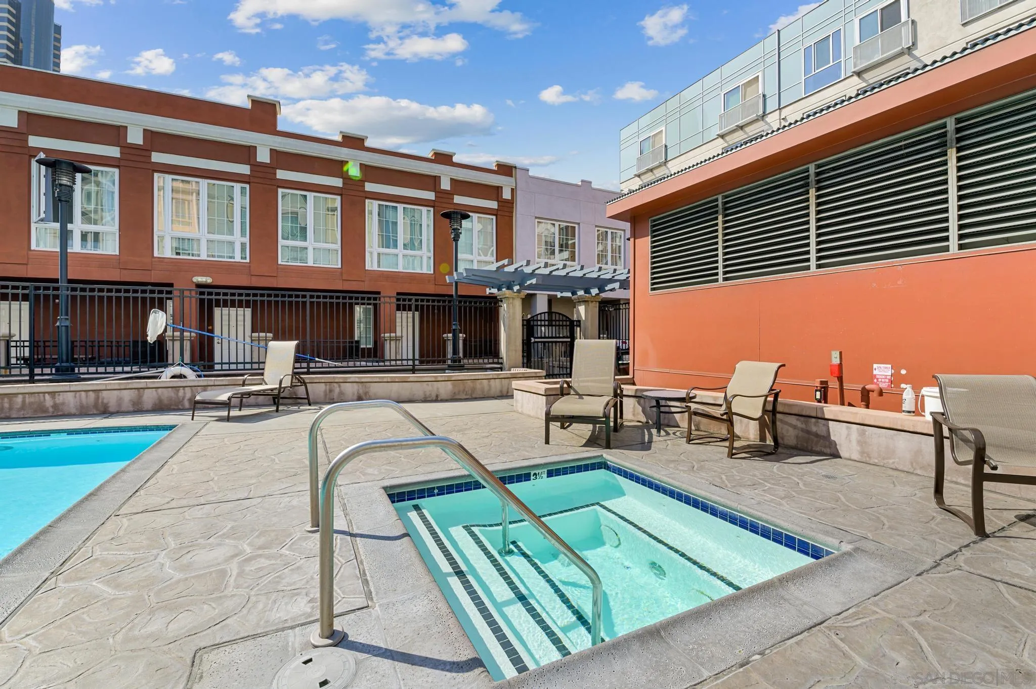450 J Street, Unit 4121 San Diego, CA 92101 - Photo 19 of 22 a view of a patio with couches table and chairs with wooden floor and fence