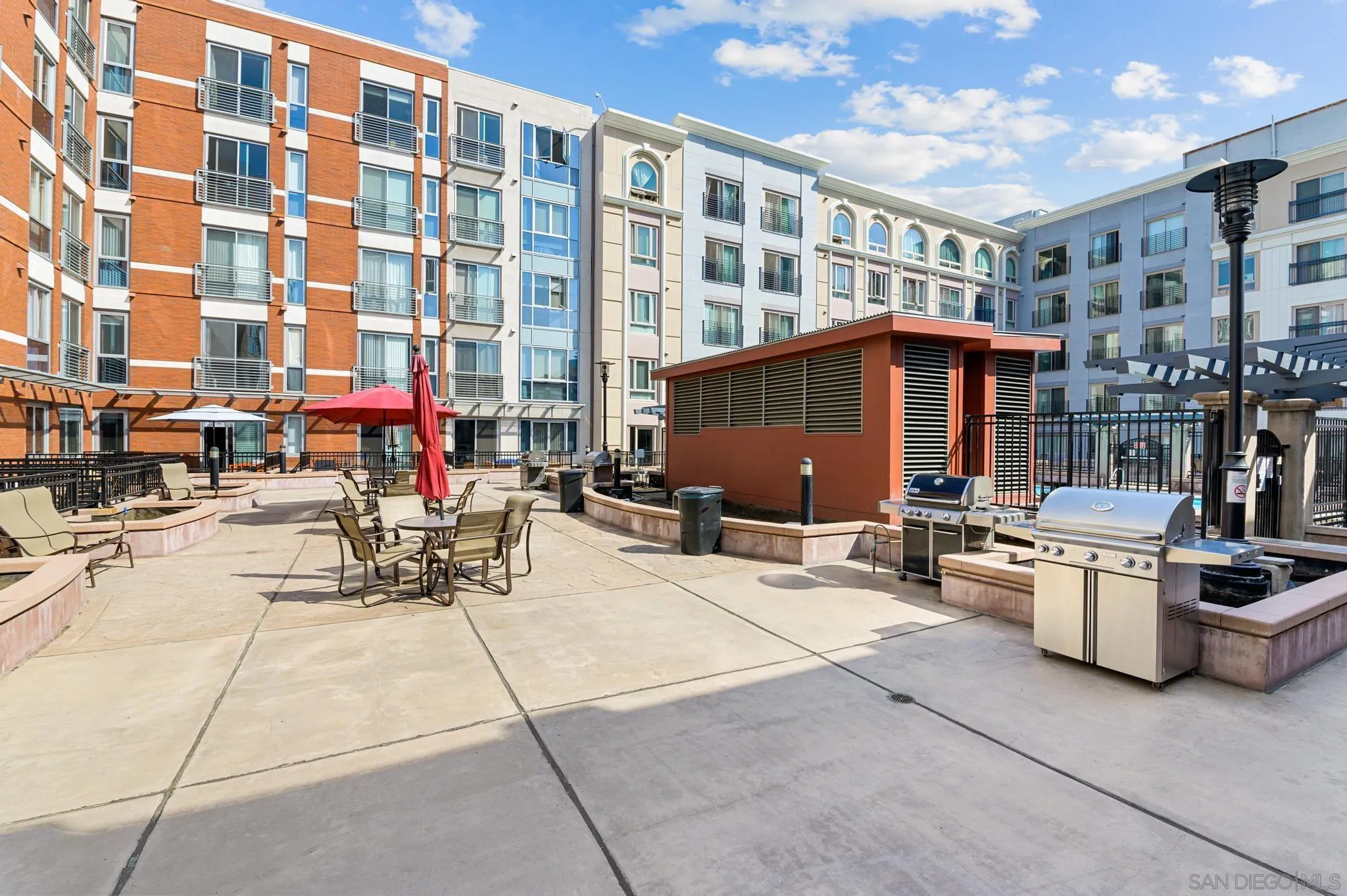 450 J Street, Unit 4121 San Diego, CA 92101 - Photo 22 of 22 a view of a patio with a table and chairs and potted plants