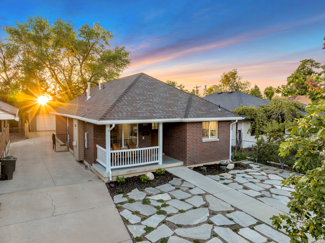 Undisclosed Address Ogden, UT 84403 - Photo 6 of 21 View of front facade with brick siding, roof with shingles, and a porch