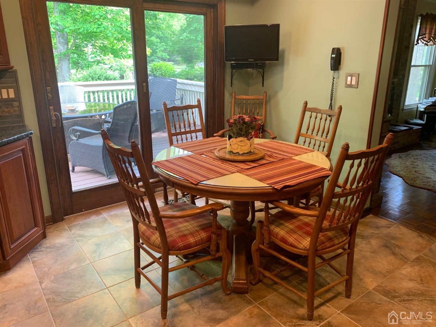 2 Fox Hill Road Edison, NJ 08820 - Photo 13 of 37 a dining room with furniture and wooden floor