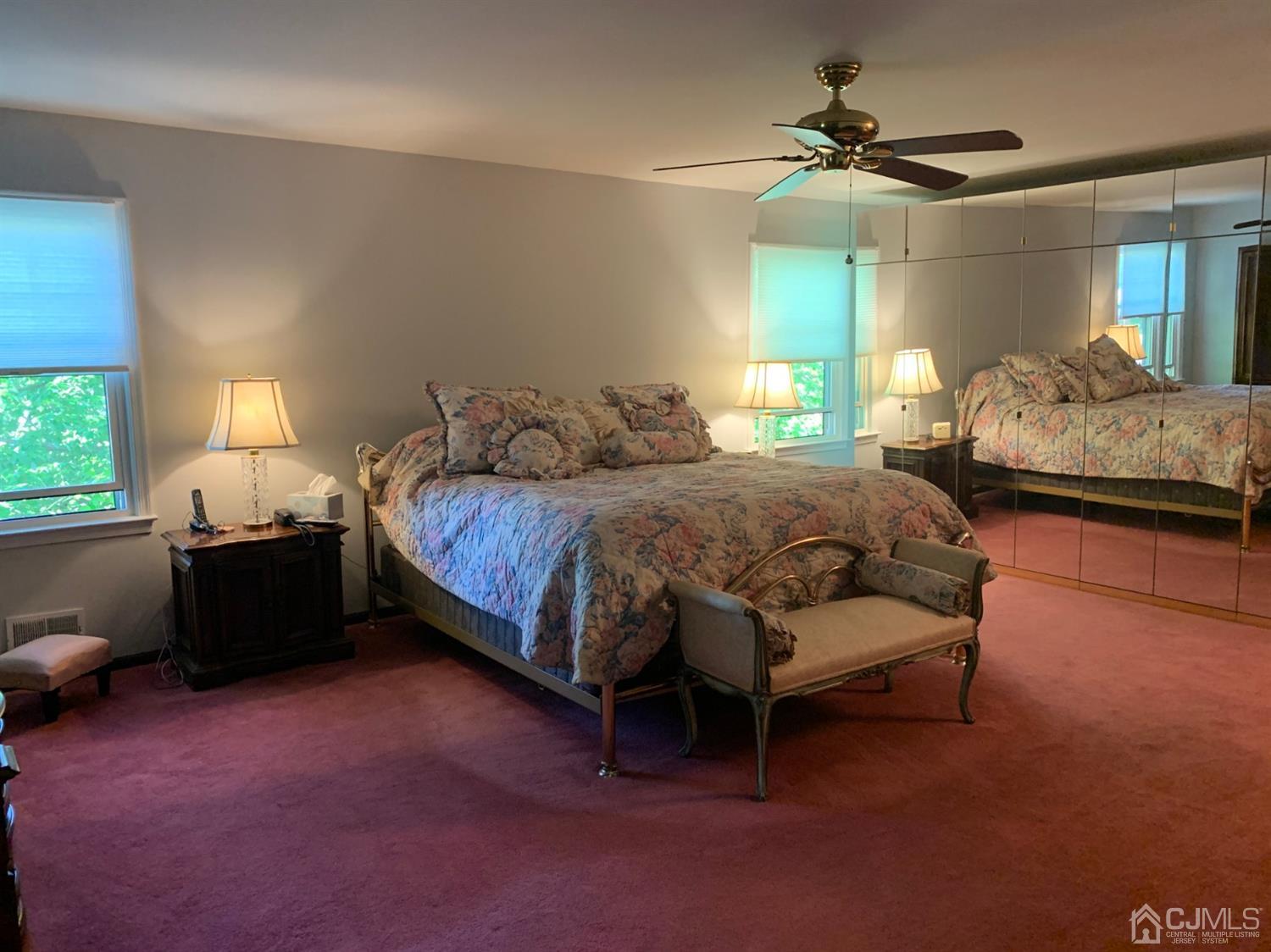 2 Fox Hill Road Edison, NJ 08820 - Photo 25 of 37 a bedroom with a bed and a chandelier