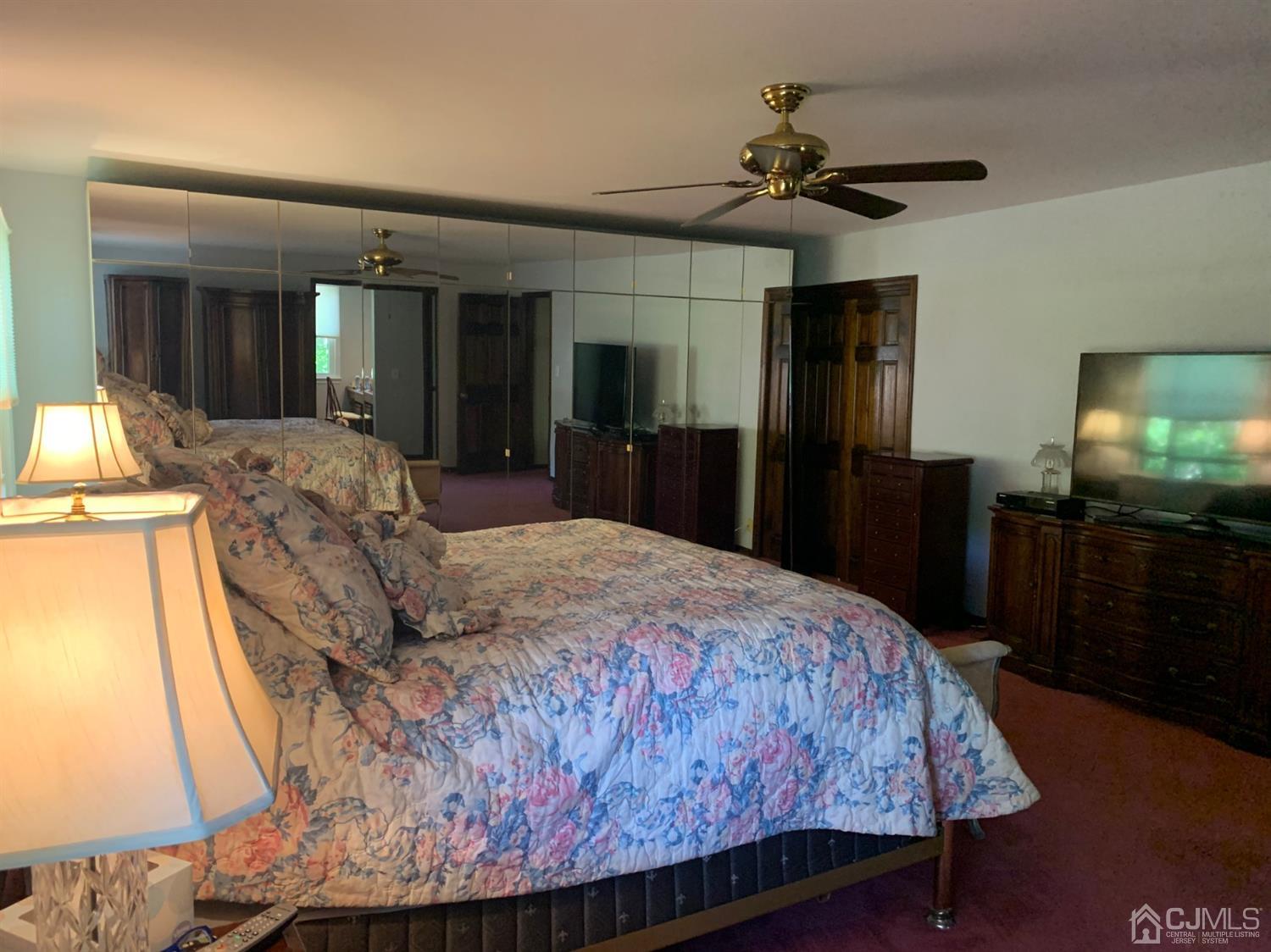 2 Fox Hill Road Edison, NJ 08820 - Photo 26 of 37 a bed room with a bed and a television
