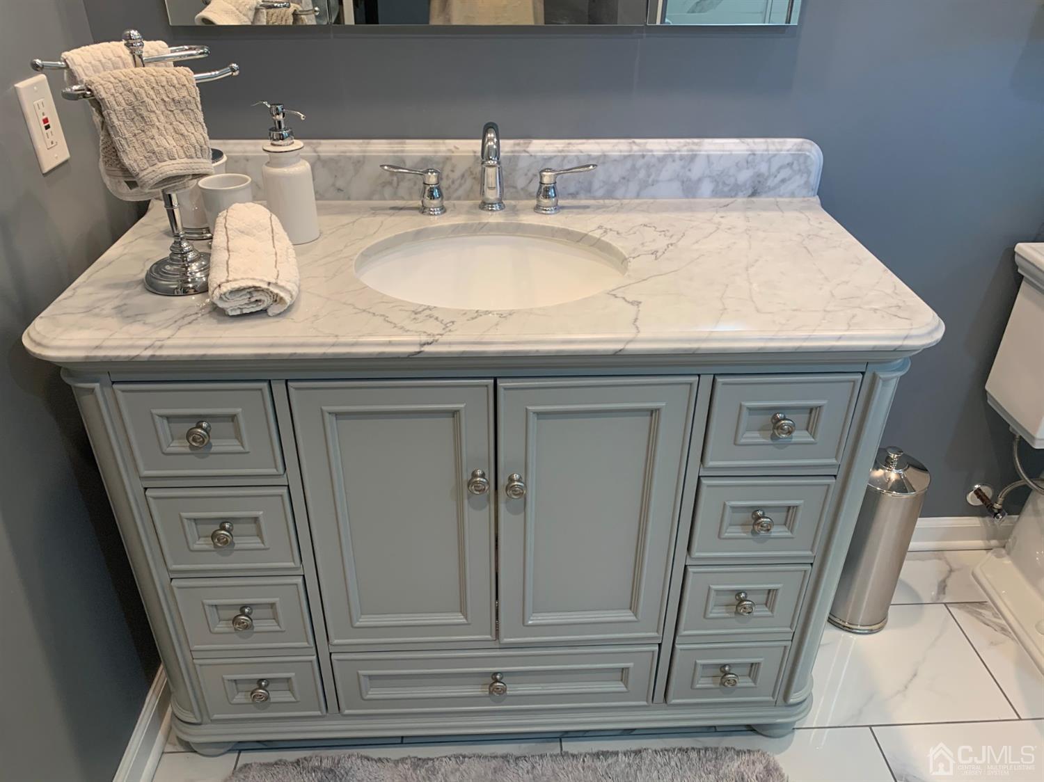 2 Fox Hill Road Edison, NJ 08820 - Photo 30 of 37 a bathroom with a sink and a mirror