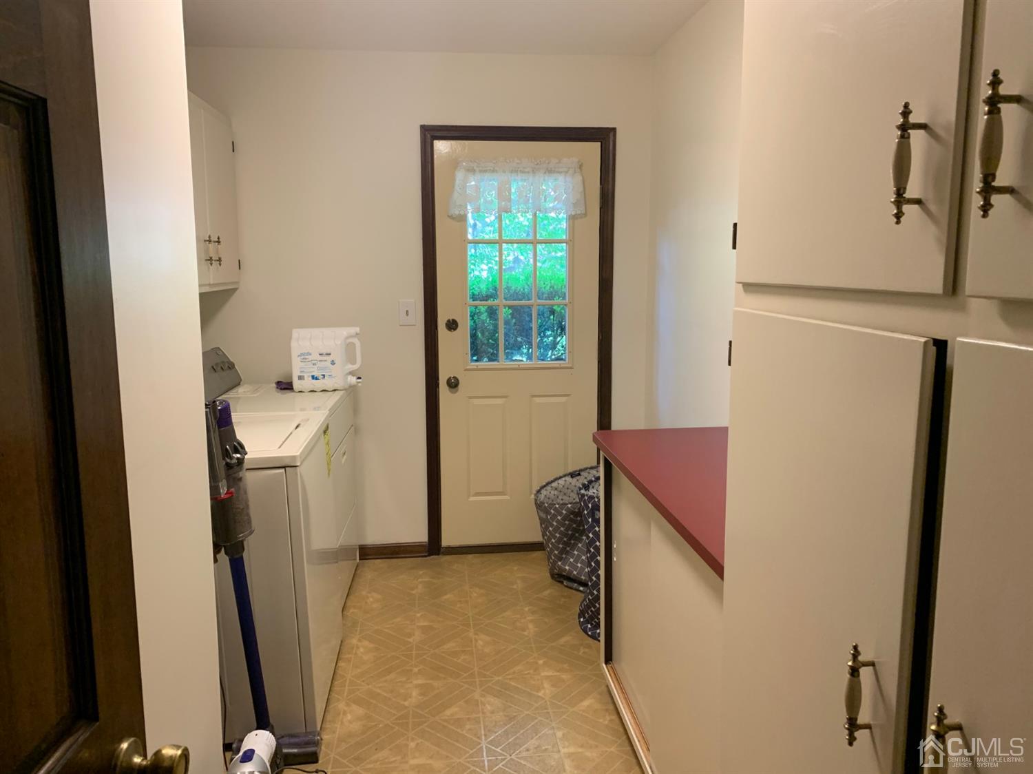 2 Fox Hill Road Edison, NJ 08820 - Photo 34 of 37 a utility room with a window dryer and washer